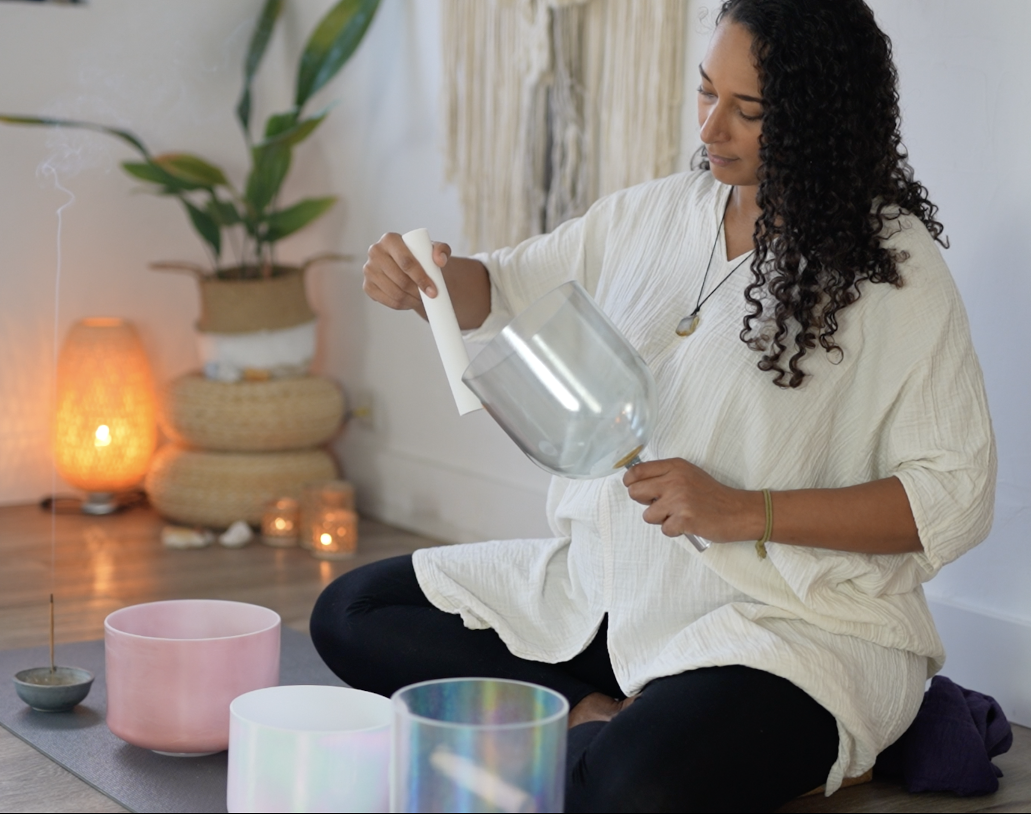 Casey playing crystal tones hand held practitioner bowl