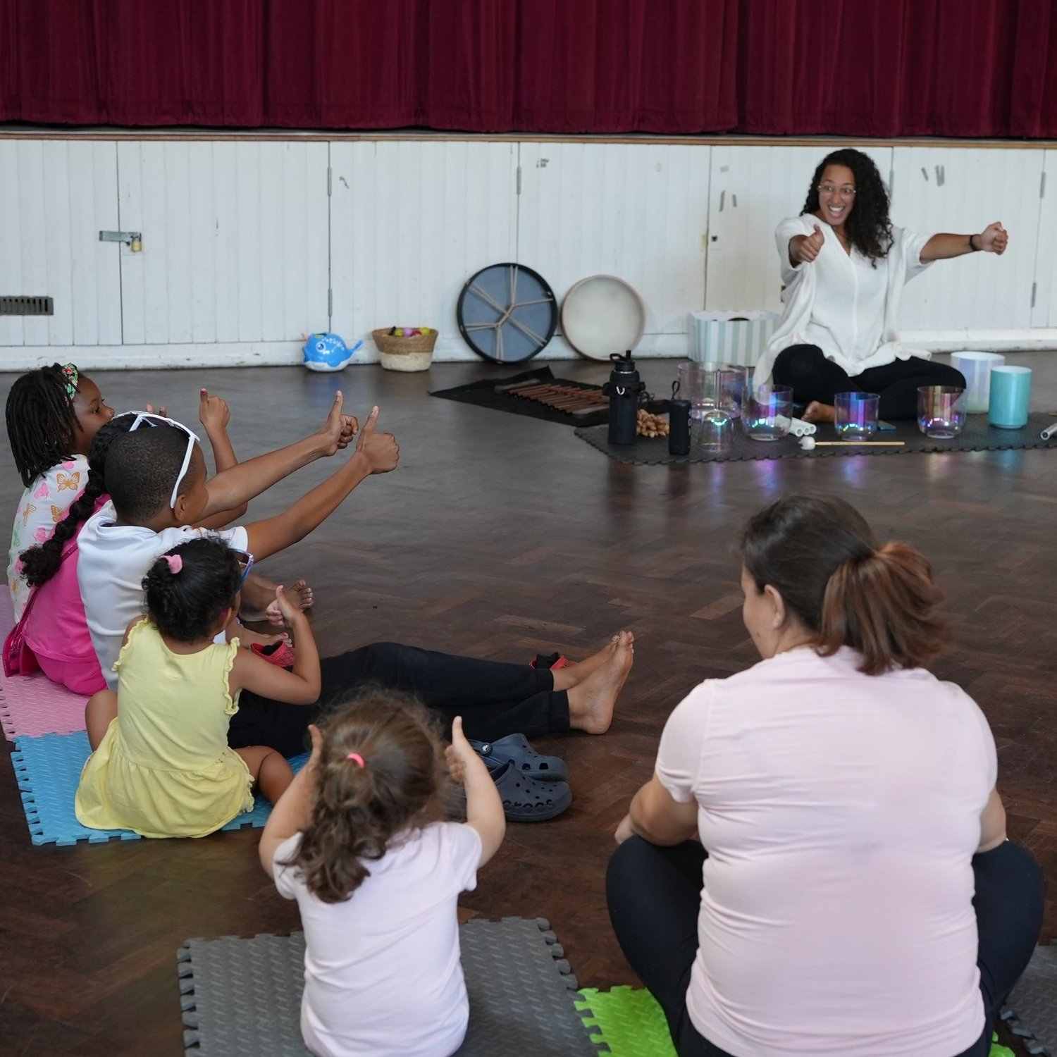 Kids with thumbs up at sound bath